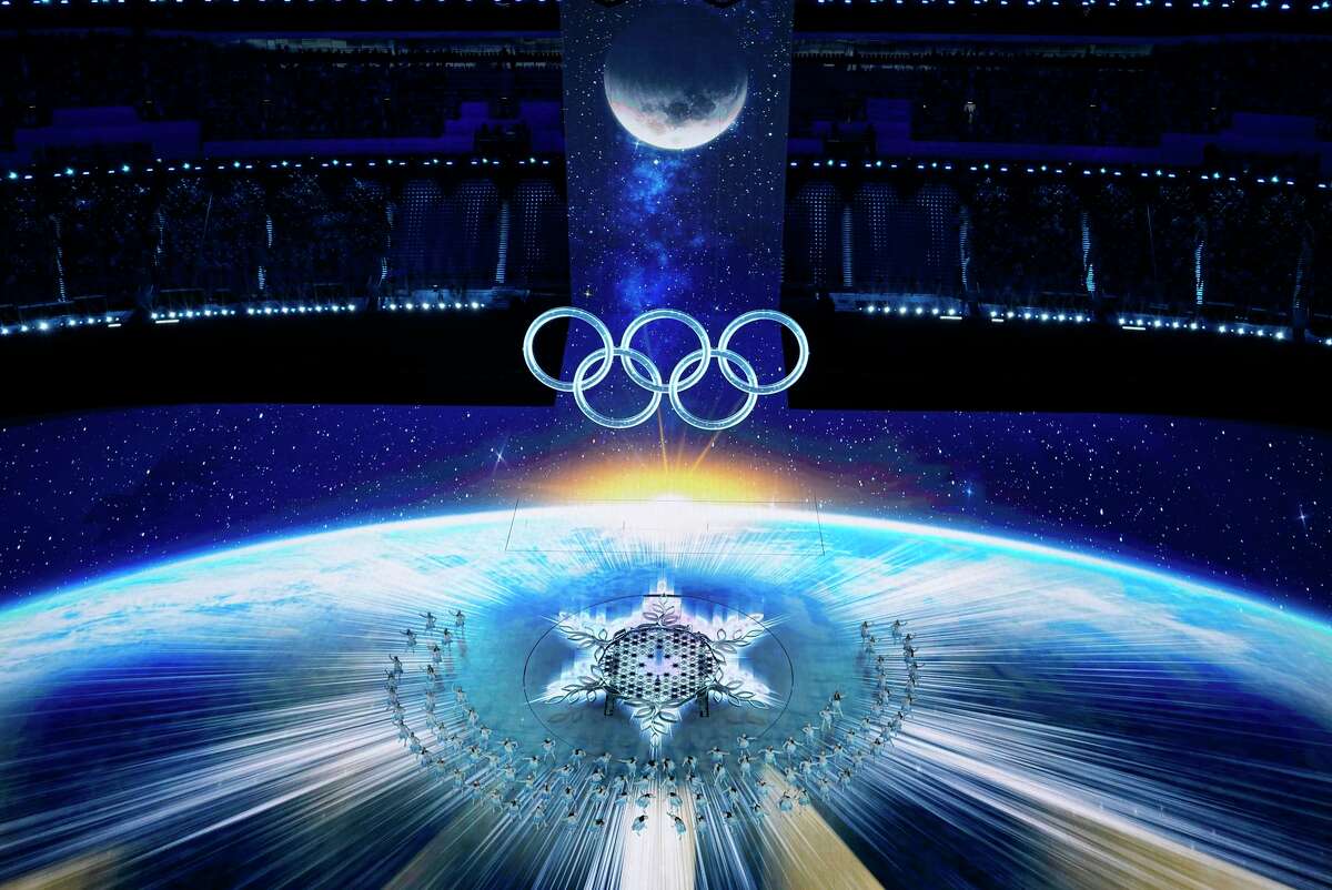 Dancers perform during the Opening Ceremony of the Winter Olympics in the same venue used during the 2008 Games.