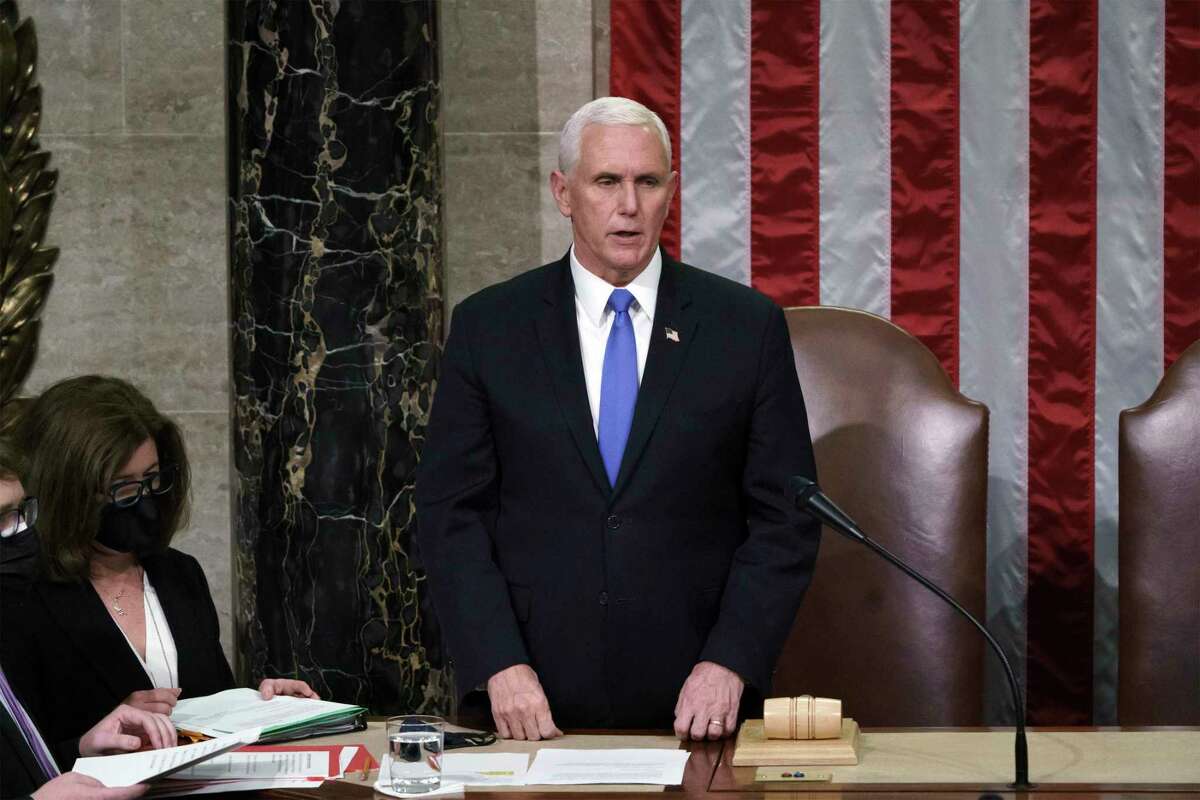 Vice President Mike Pence reads the final certification of Electoral College votes cast in November's presidential election during a joint session of Congress, after working through the night, at the Capitol in Washington, D.C., on Jan. 7, 2021. (J. Scott Applewhite /Pool/Getty Images/TNS)
