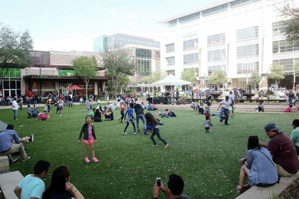 Crowds gather for live music at CityCentre, a mixed-use development in the Memorial City district of Houston.