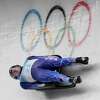 Tucker West, of United States, slides during a luge men's run at the 2022 Winter Olympics, Saturday, Feb. 5, 2022, in the Yanqing district of Beijing. (AP Photo/Mark Schiefelbein)