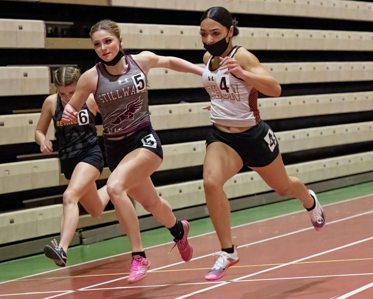 Mohonasen senior Zionna Perez-Tucker (right) and Stillwater senior Gianna Locci battle it out in the 55-meter dash at the indoor track state qualifier at Hudson Valley Community College. Perez-Tucker earned Athlete of the Year honors.