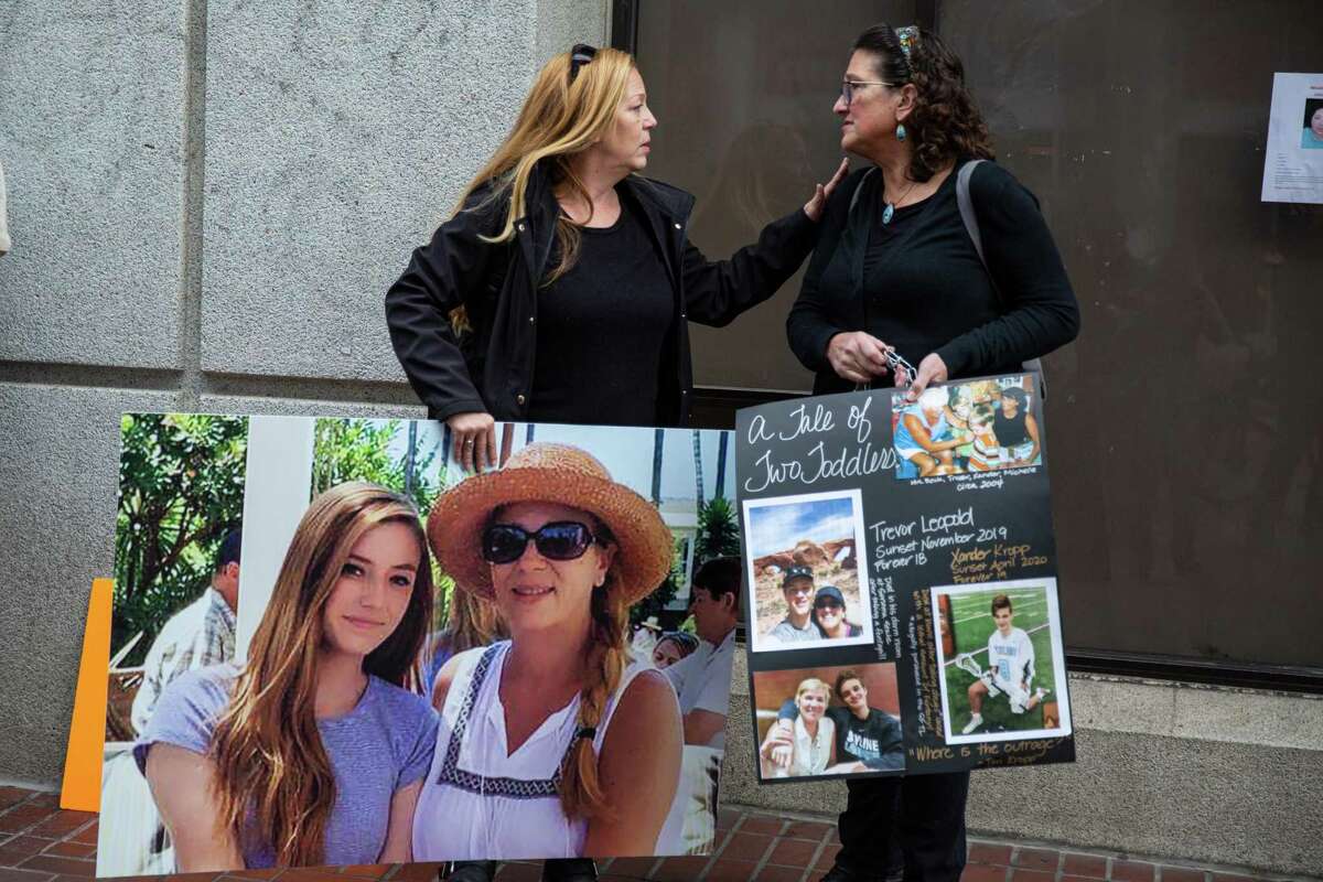 During a protest led by mothers affected by the drug crisis, Gina McDonald, left, speaks to Michelle Leopold, both attending to protest against open drug use at the S.F. Linkage Center on Saturday, Feb. 5, 2022 in San Francisco.