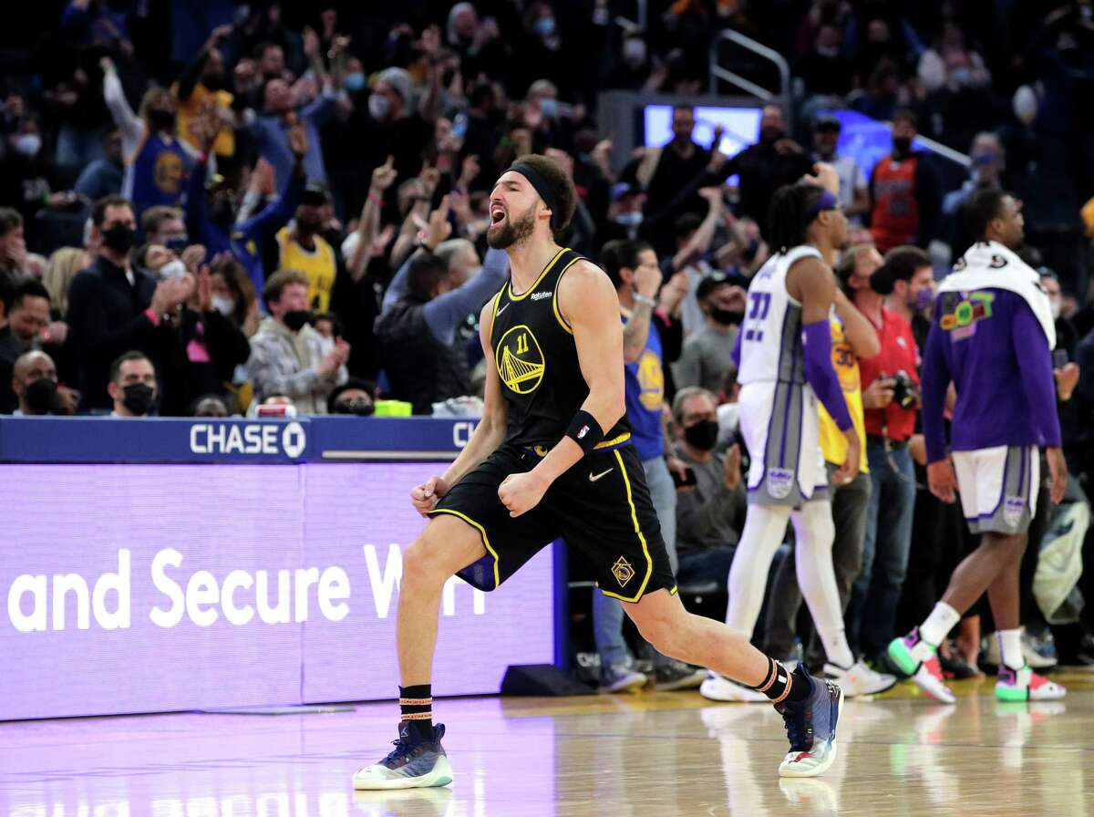 Klay Thompson (11) celebrates after hitting a three pointer in the second half as the Golden State Warriors played the Sacramento Kings at Chase Center in San Francisco, Calif., on Thursday, February 3, 2022.