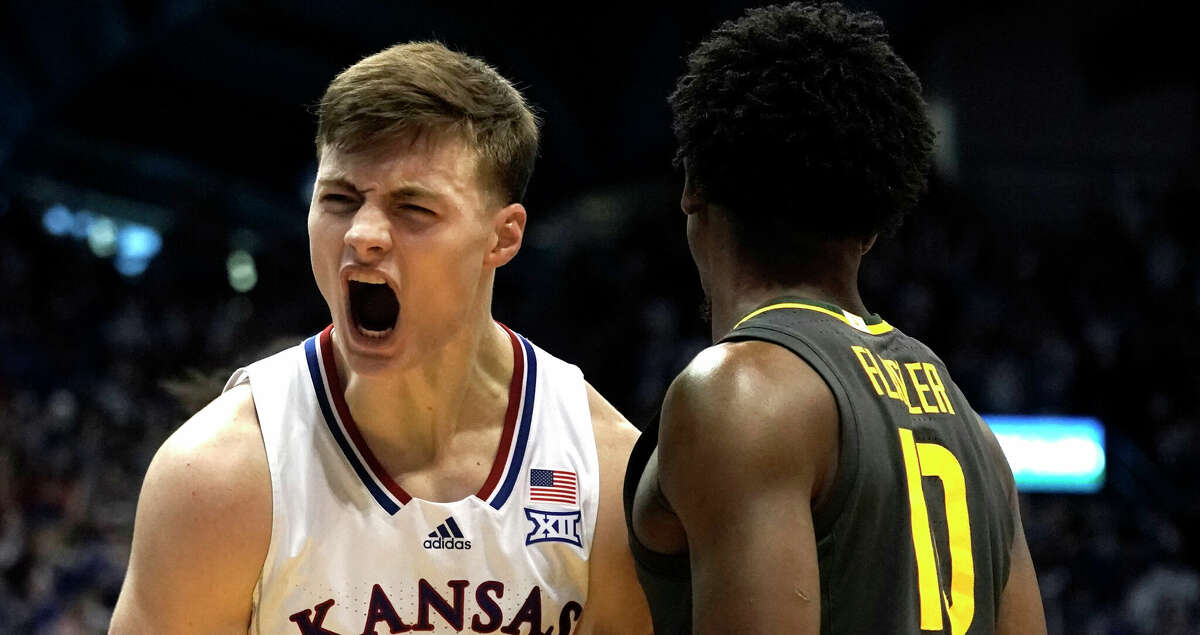 Kansas guard Christian Braun (2) celebrates after a shot during the first half of an NCAA college basketball game against Baylor Saturday, Feb. 5, 2022, in Lawrence, Kan. (AP Photo/Charlie Riedel)