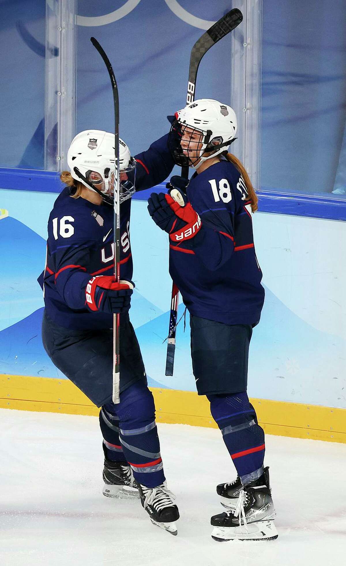 U.S. forward Jesse Compher (18) celebrates her goal with forward Hayley Scamurra (16) in the third period.