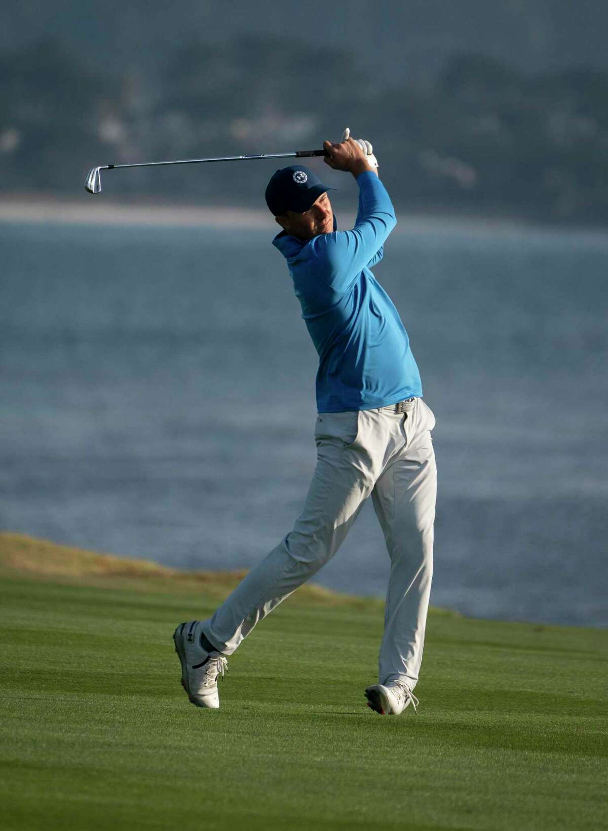 Jordan Spieth drives from the fairway at the 18th hole on the Pebble Beach Golf Links at the AT&T Pebble Beach Pro-Am on Saturday, Feb. 5, 2022 in Pebble Beach, Calif.