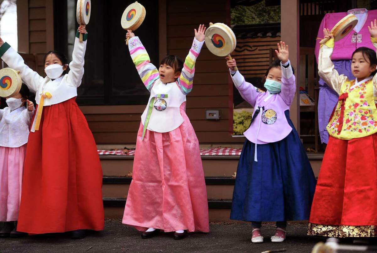 Above, in traditional dress, children perform a Korean dance at AAPI Westport’s Lunar New Year Celebration at the Westport/Weston YMCA in Westport on Saturday.