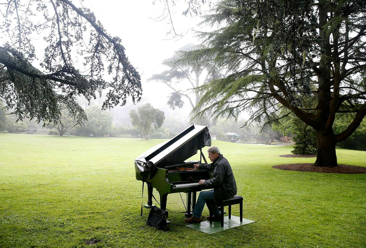 John McArdle tunes a baby grand in the Great Meadow for the 2019 Flower Piano event at the S.F. Botanical Garden in San Francisco. The pianos return later this year.