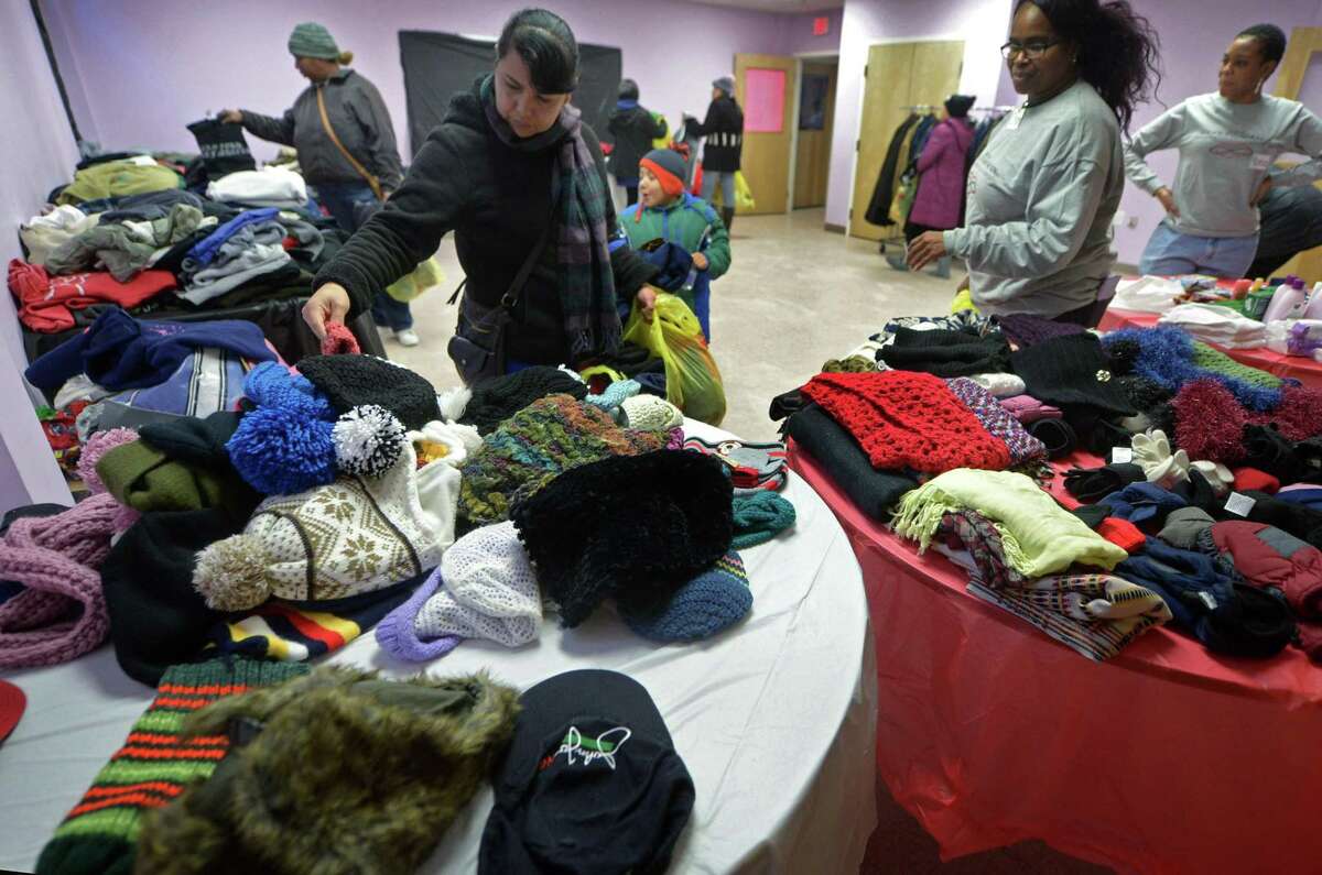 Locals look for clothing at the DDH Hope Foundation Hoodies for the Homeless event Satuday, December 1, 2018, in Norwalk, Conn.