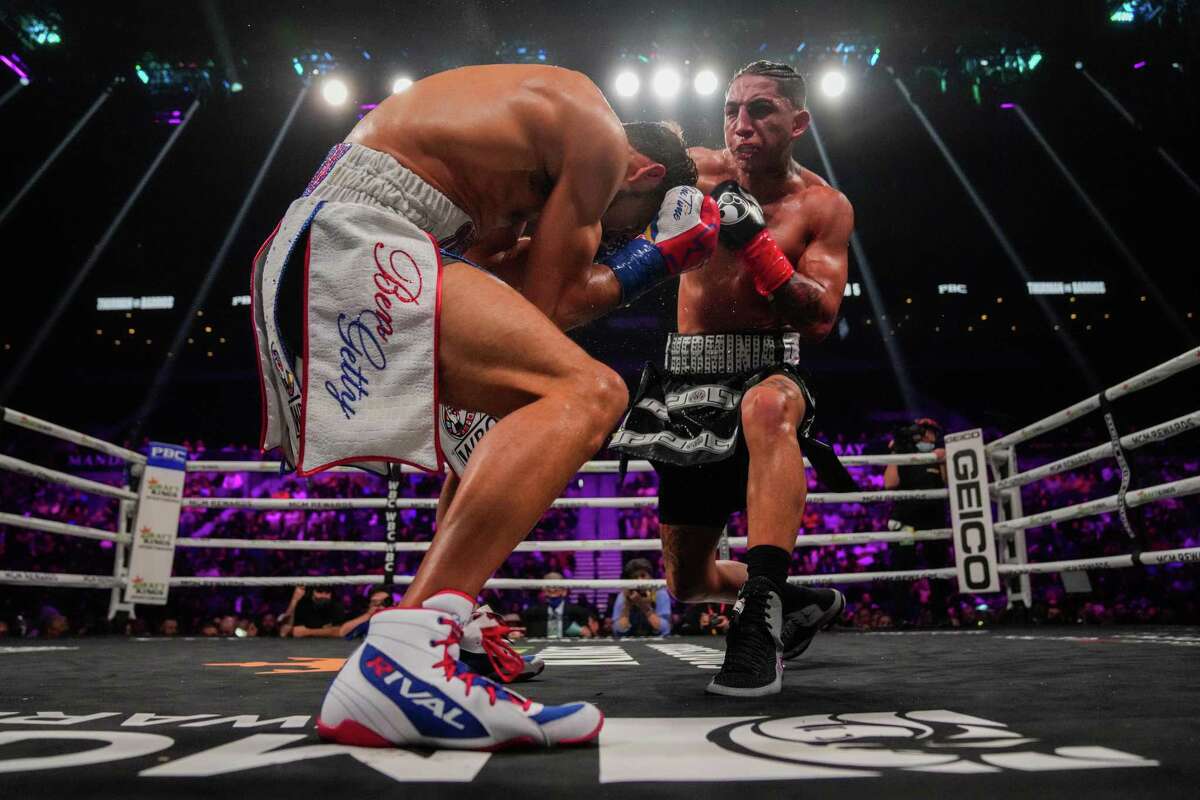LAS VEGAS, NEVADA - FEBRUARY 05: Keith Thurman takes a right from Mario Barrios during a welterweight bout at Michelob ULTRA Arena on February 05, 2022 in Las Vegas, Nevada. Thurman won by unanimous decision. (Photo by Joe Buglewicz/Getty Images)