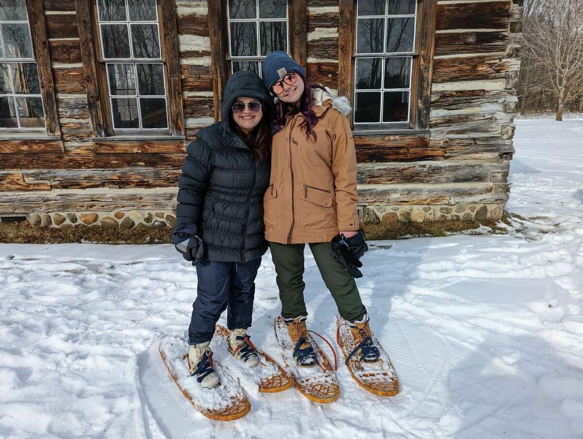 Carrie Paxton, right, and friend Crystal Ginderske, both of Saginaw, attempted snowshoeing for the first time at the Chippewa Nature Center on Saturday.