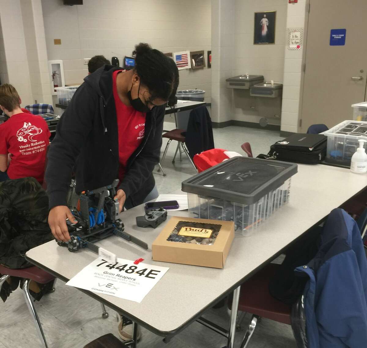 Hanesis Bell works on her team's robot at the Vex Robotics Challenge Pitching In tournament held Jan. 29. 