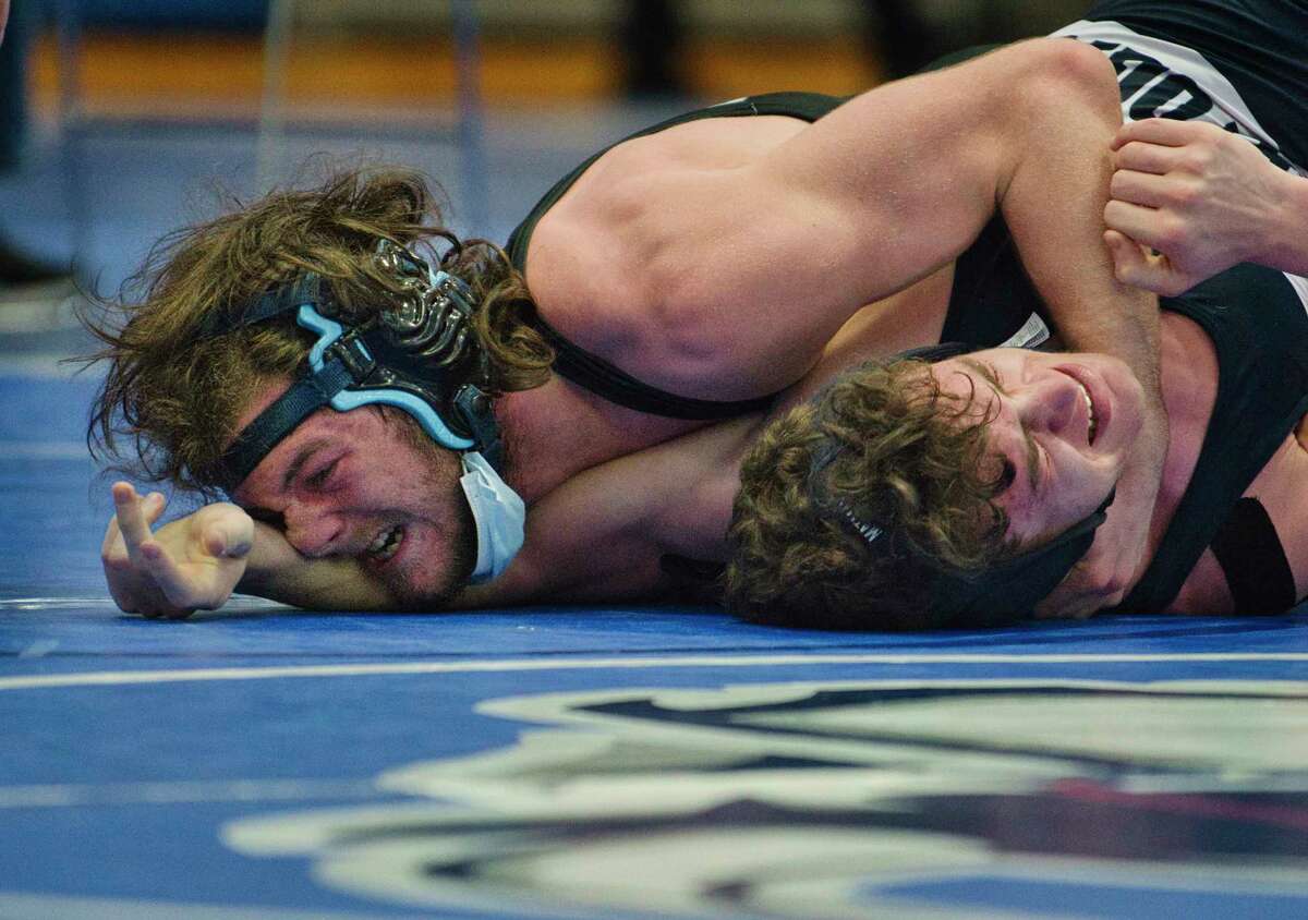 Charlie Welcome of Columbia, left, wrestles against Sachiel Chuckrow of Saratoga during the Class A wrestling sectionals at Shaker High School on Sunday, Feb. 6, 2022, in Latham, N.Y. Welcome won the 160 pound match.