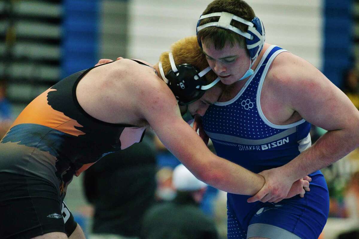 Keith Heineman of Bethlehem, left, wrestles against Ryan Stein of Shaker during the Class A wrestling sectionals at Shaker High School on Sunday, Feb. 6, 2022, in Latham, N.Y. Stein won the 215 pound match.