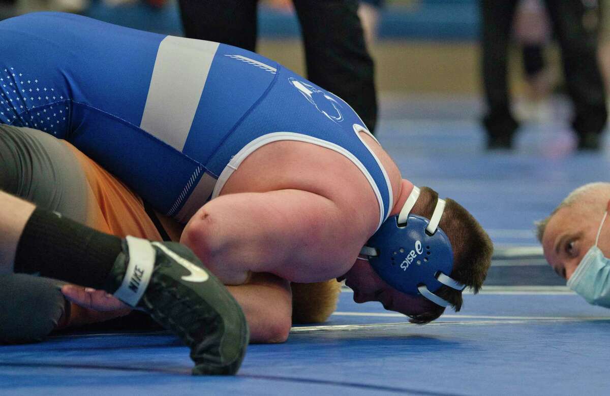 Ryan Stein of Shaker, top, wrestles against Keith Heineman of Bethlehem during the Class A wrestling sectionals at Shaker High School on Sunday, Feb. 6, 2022, in Latham, N.Y. Stein won the 215 pound match.