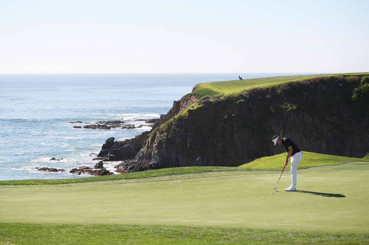 PEBBLE BEACH, CALIFORNIA - FEBRUARY 06: Beau Hossler of the United States putts on the eighth green during the final round of the AT&T Pebble Beach Pro-Am at Pebble Beach Golf Links on February 06, 2022 in Pebble Beach, California. (Photo by Orlando Ramirez/Getty Images)