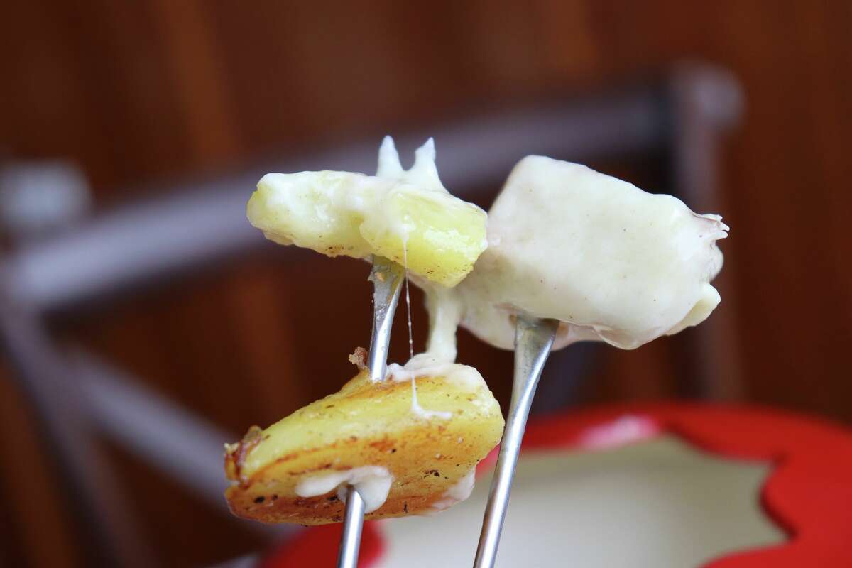Fondue savoyarde at Appetit Bistro, served with thick bacon, croutons and potatoes.