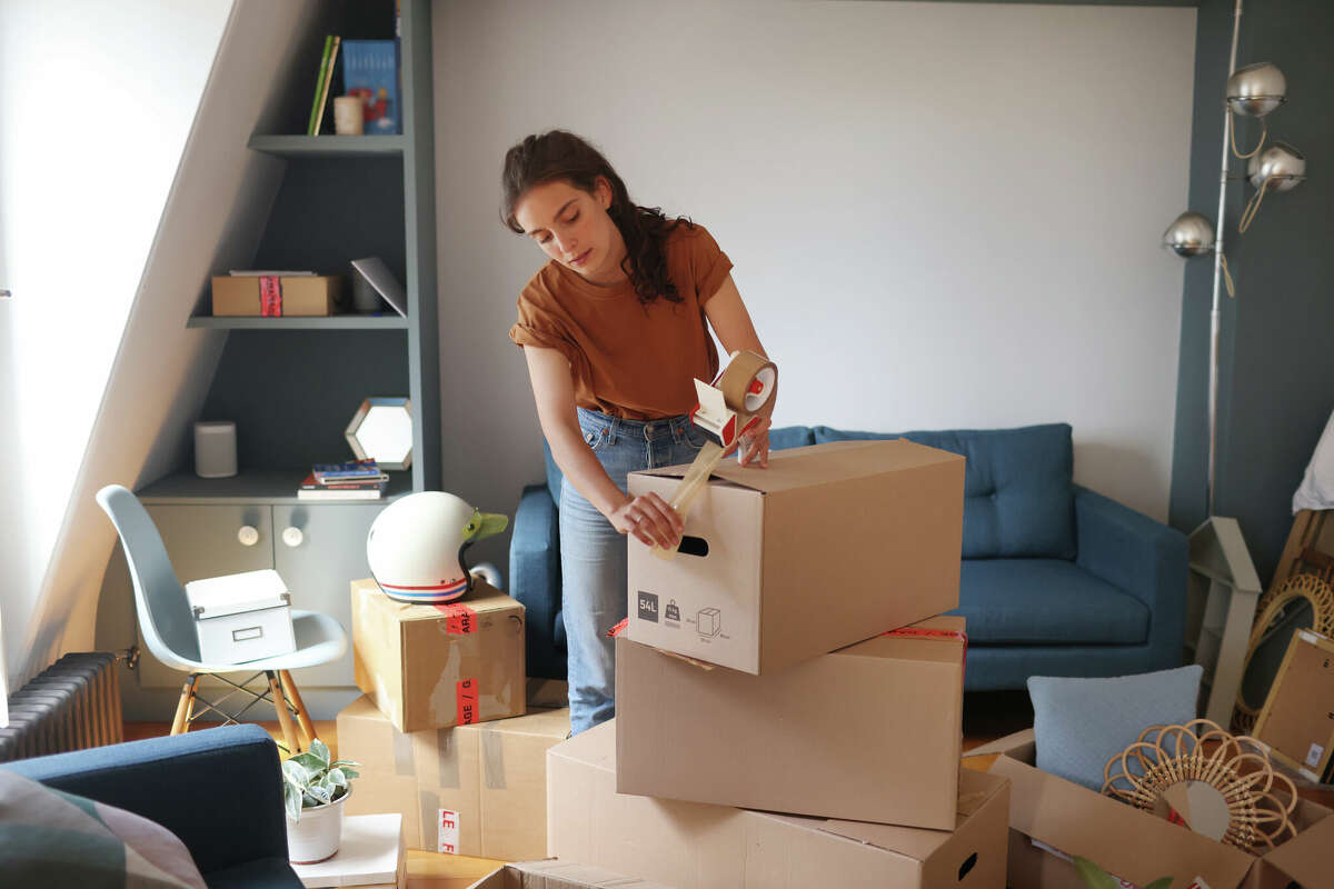A young woman moving into a new apartment