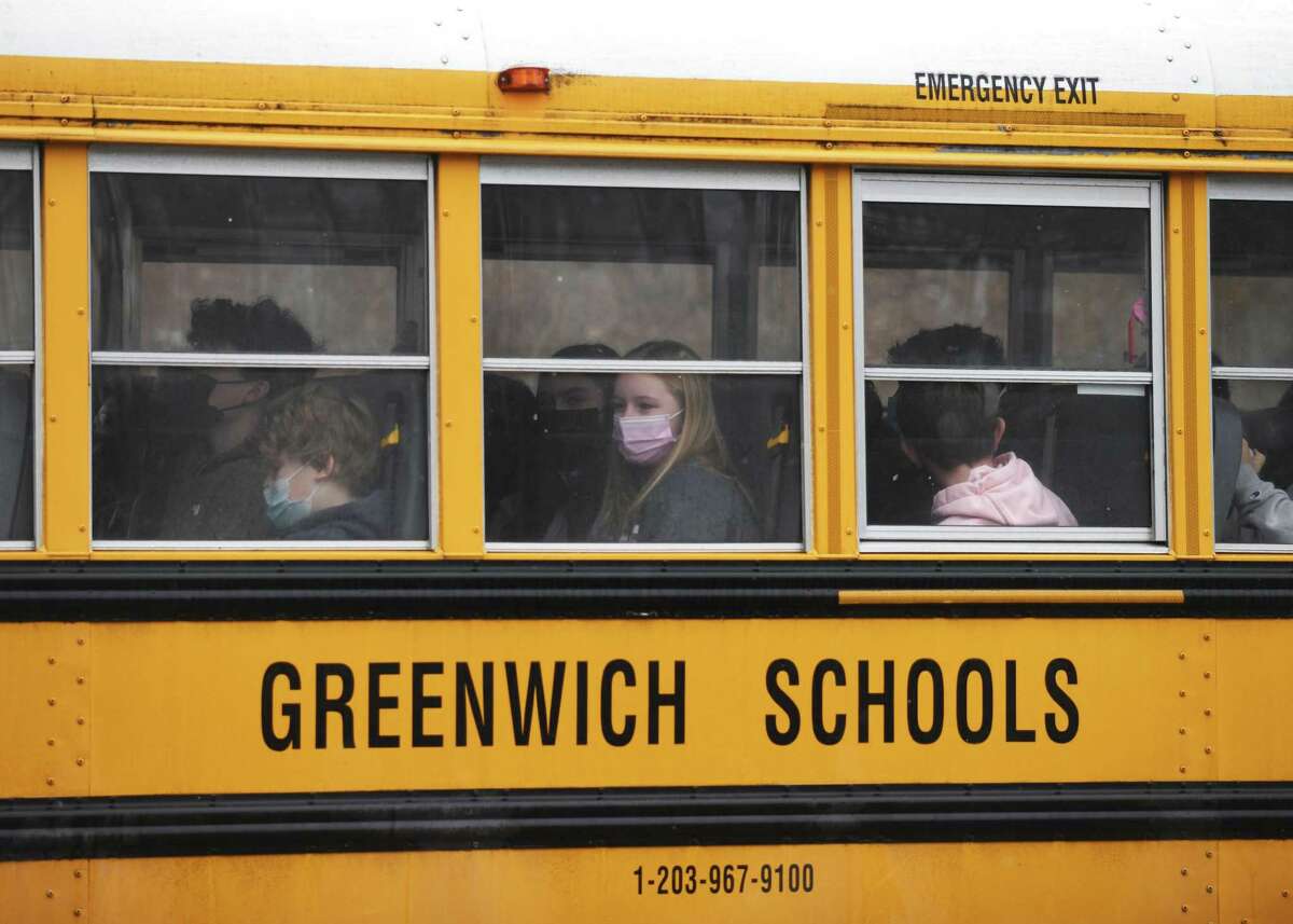 Shuttle buses take Central Middle School students to different schools in Greenwich on Feb. 7 after the building was closed temporarily.