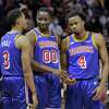 Jordan Poole (3), Jonathan Kuminga (00) and Moses Moody (4) talk during a timeout in the second half as the Golden State Warriors played the Detroit Pistons at Chase Center in San Francisco, Calif., on Tuesday, January 18, 2022.