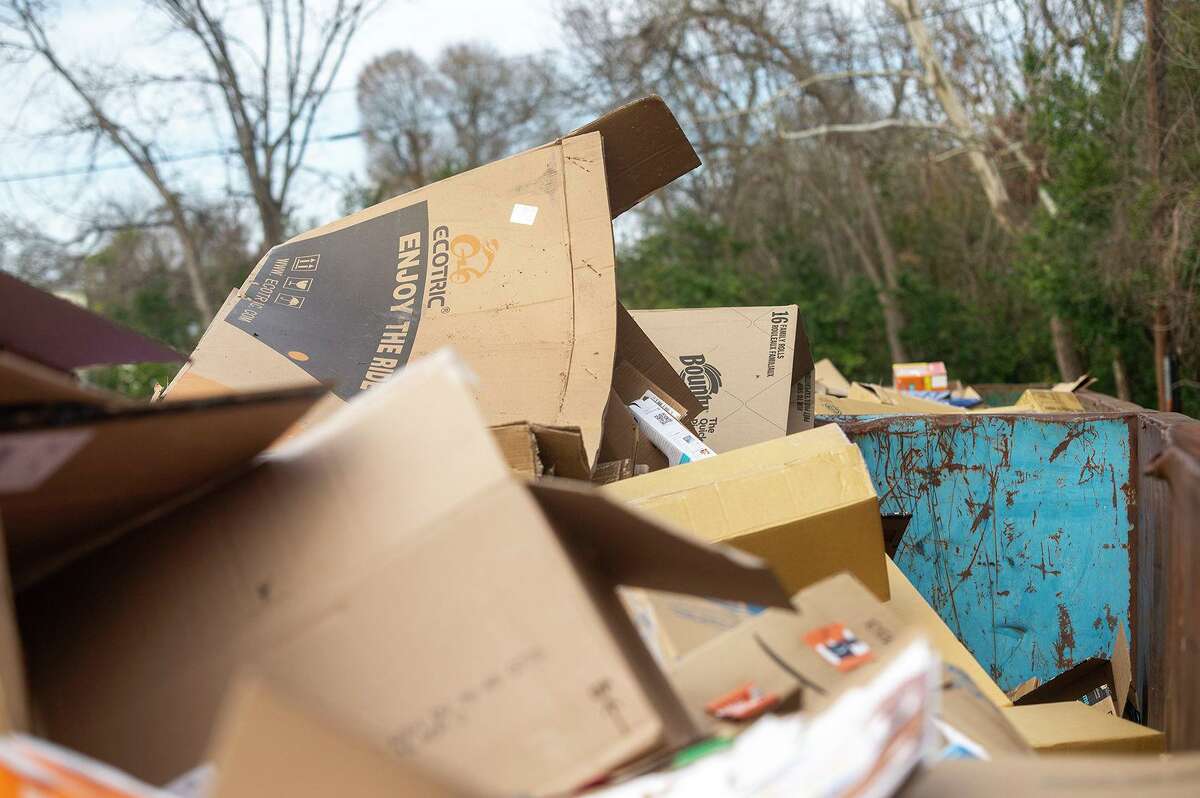 Recycling bins are filled with cardboard behind the Nacogdoches public library Thursday. Glass recycling has been on pause for two years, but the city still accepts cardboard. (Josh Edwards/The Daily Sentinel)