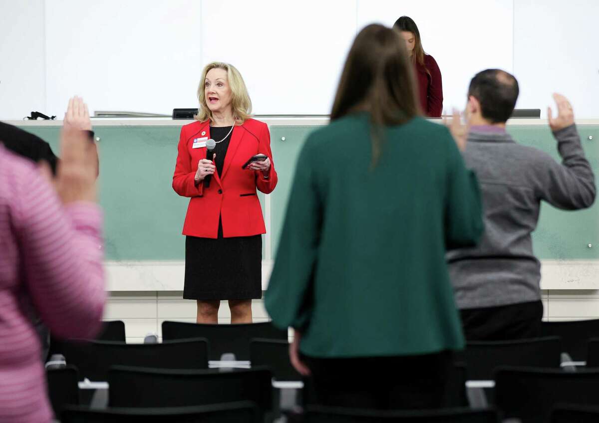 Harris County District Clerk Marilyn Burgess, center, leads an oath of jury for potential jurors inside the Harris County Jury Assembly building on Monday, Feb. 7, 2022, in Houston.