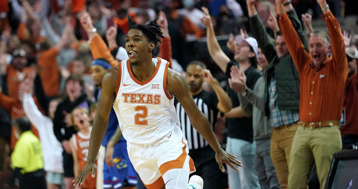Texas guard Marcus Carr (2) celebrates after making a basket at the end of the first half of an NCAA college basketball game against Kansas, Monday, Feb. 7, 2022, in Austin, Texas. (AP Photo/Eric Gay)