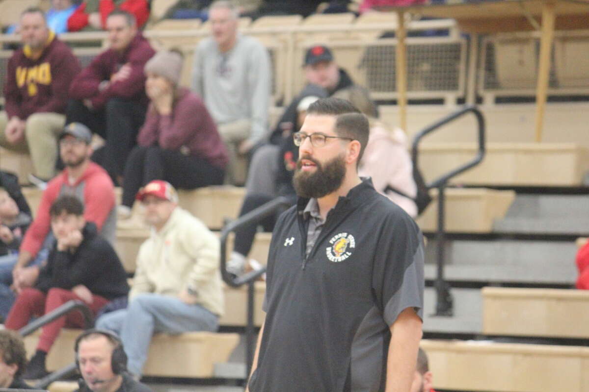 Ferris men's basketball coach Andy Bronkema watched as his Bulldogs suffered their first league loss of the season on Monday. Ferris coach Andy Bronkema's Bulldogs suffered their first league loss of the season on Monday.
