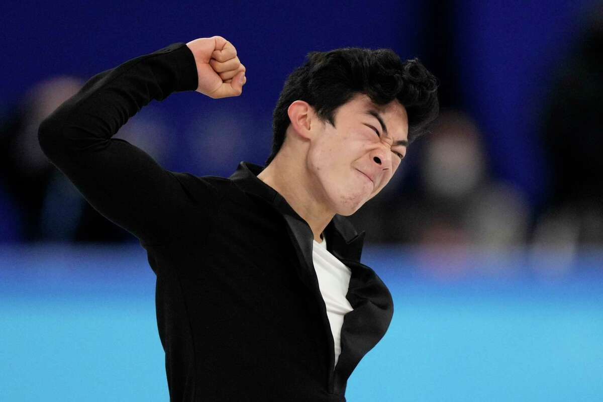 Nathan Chen, of the United States, reacts following the men's short program figure skating competition at the 2022 Winter Olympics, Tuesday, Feb. 8, 2022, in Beijing. (AP Photo/Bernat Armangue)