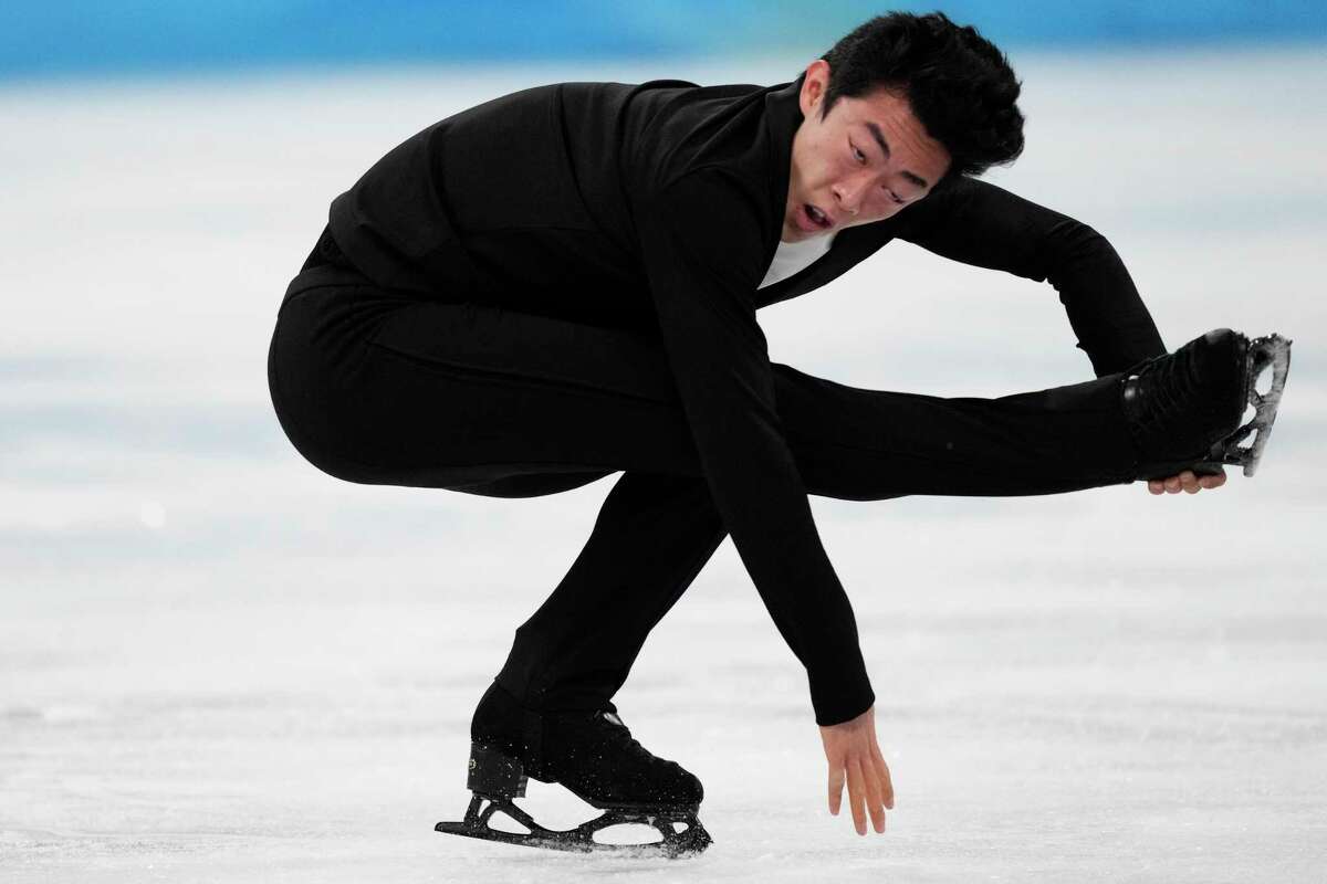 Nathan Chen, of the United States, competes during the men's short program figure skating competition at the 2022 Winter Olympics, Tuesday, Feb. 8, 2022, in Beijing. (AP Photo/Bernat Armangue)