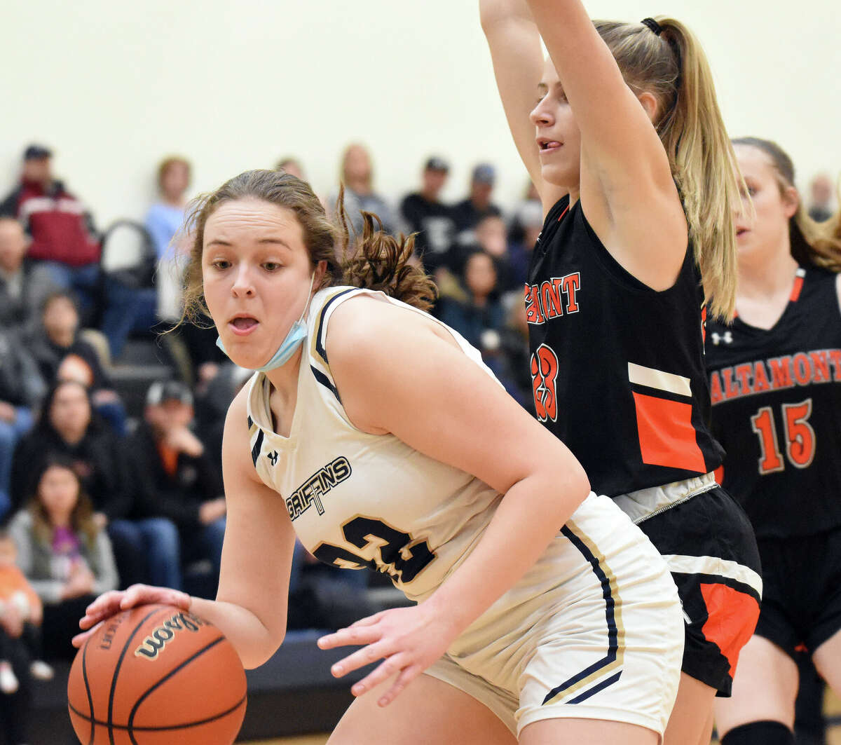 Father McGivney's Charlize Luehmann positions herself under the basket during the first half against Altamont on Monday in Glen Carbon.