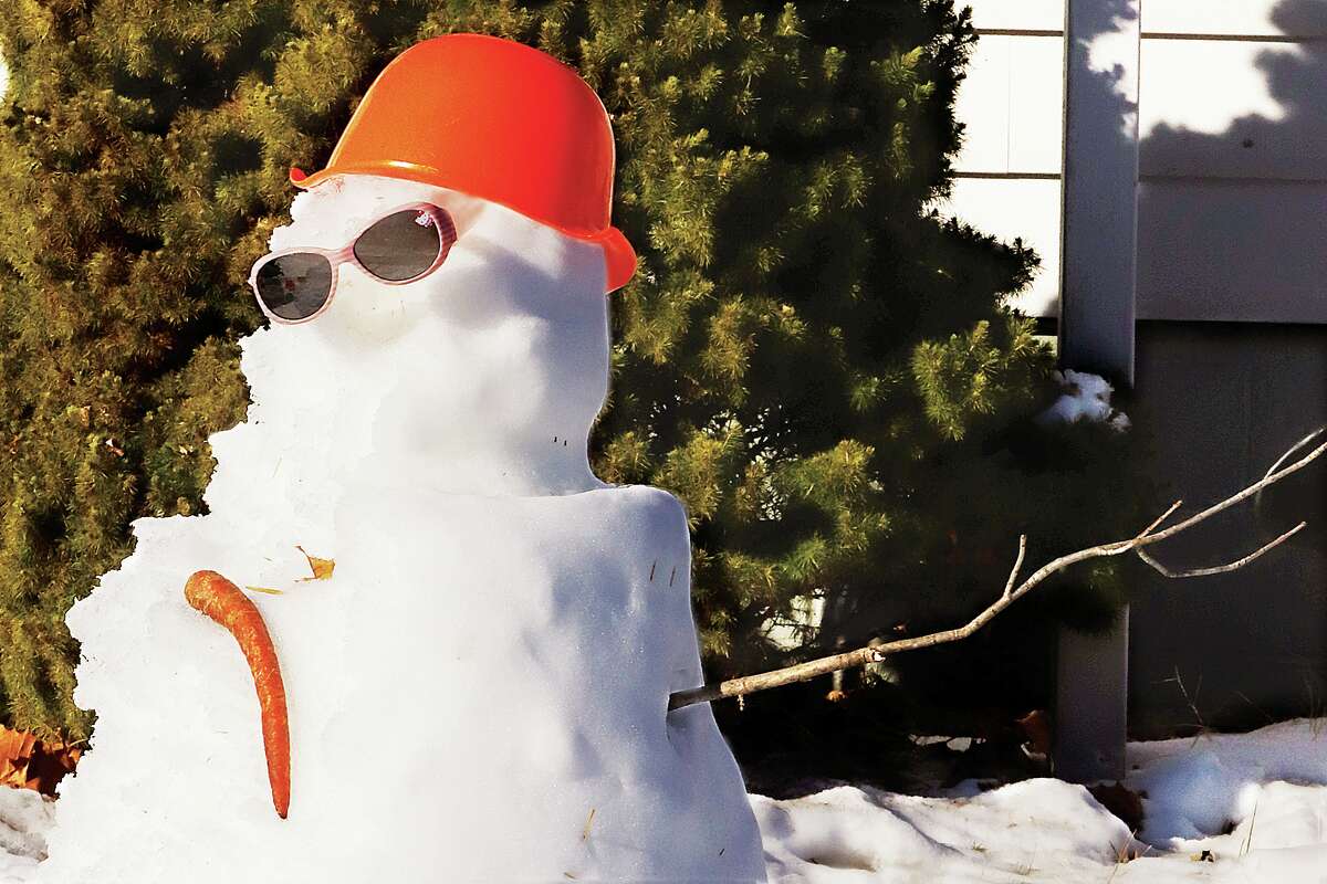 John Badman|The Telegraph Tuesday's warm weather and sunshine were not kind to the snowmen built after last week's storm. This potheaded snowman in the 500 block of 12th Street in Wood River had already lost his nose and one arm my mid-morning. The mercury had risen to a balmy temperature of nearly 60 degrees by late afternoon on Tuesday.