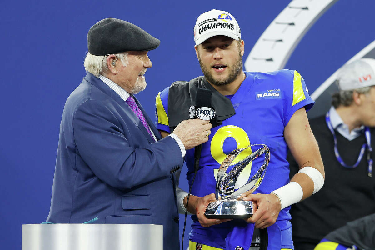 Matthew Stafford #9 of the Los Angeles Rams speaks to Terry Bradshaw while holding the George Halas Trophy after defeating the San Francisco 49ers in the NFC Championship Game at SoFi Stadium on January 30, 2022 in Inglewood, California. The Rams defeated the 49ers 20-17. 