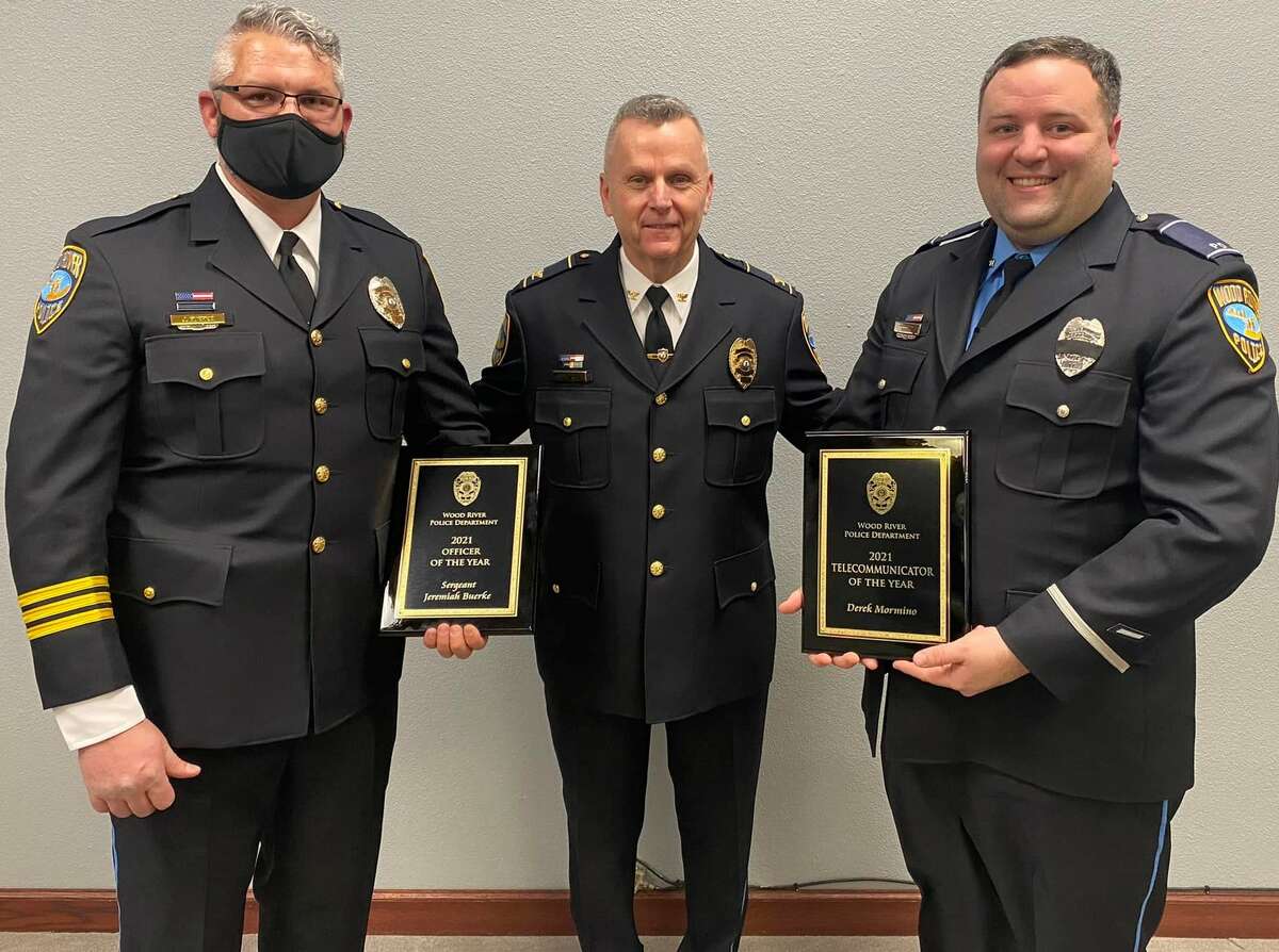 Two Wood River police officers were honored at Monday night's council meeting. Wood River Police Sgt. Jeremiah Buerke, left, was honored as the Officer of the Year. Wood River Telecommunicator Derek Mormino, right, was honored as the Telecommunicator of the Year. With them is Wood River Police Chief Brad Wells.