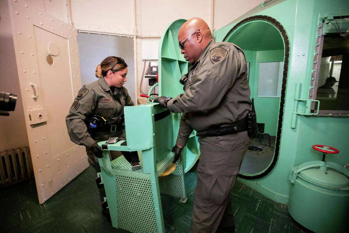 Correctional officers dismantle the gas chamber at San Quentin State Prison in March 2019 after Gov. Gavin Newsom ordered a moratorium on executions.