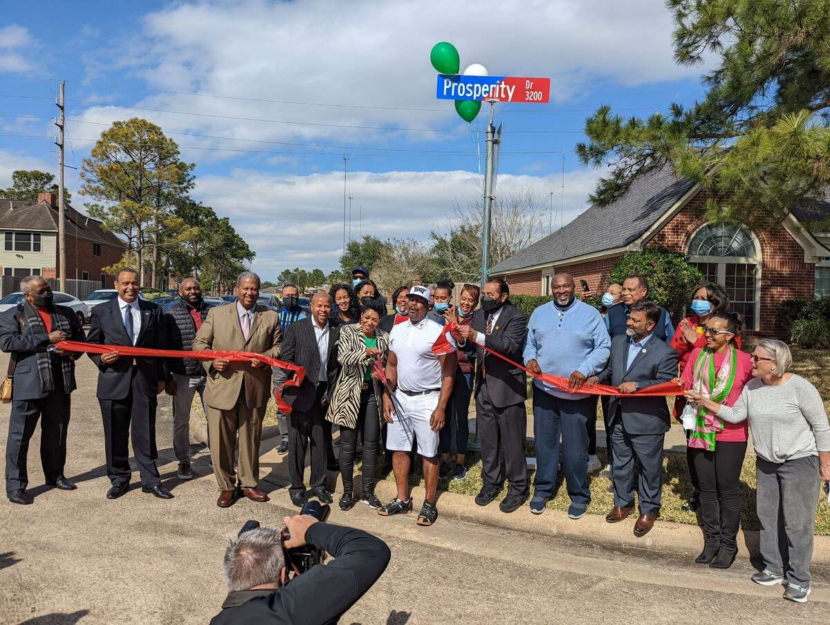 Residents and elected officials celebrate the renaming of “Confederate Drive” in Missouri City’s Vicksburg subdivision to “Prosperity Drive.”