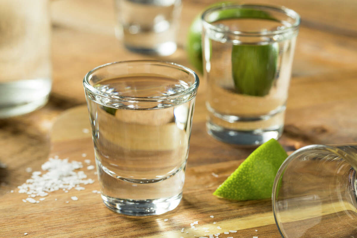 Mezcal tequila shots with lime and salt.