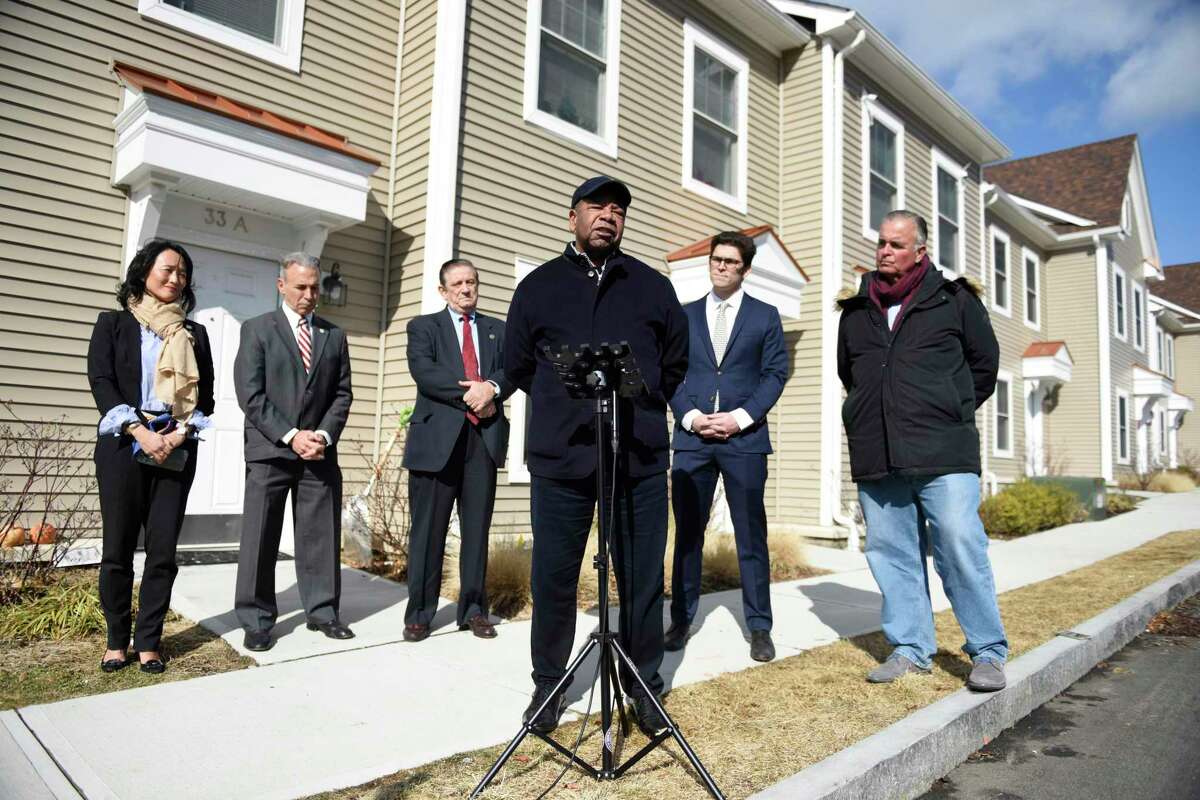 Greenwich Communities CEO Anthony Johnson speaks at a press conference outside the Armstrong Court public housing complex in the Chickahominy section of Greenwich, Conn. Tuesday, Feb. 8, 2022. Local and state elected officials joined Greenwich Housing Authority officials to speak out against the 8-30g law, which is a state-mandated target of 10 percent of the housing in each community deemed as "affordable."