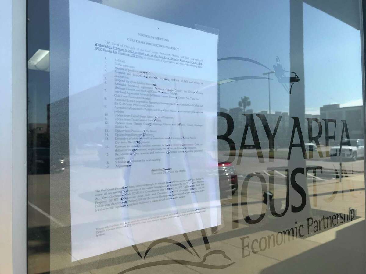 The February meeting agenda for the Gulf Coast Protection District was posted on the front door of the Bay Area Houston Economic Partnership office on Tuesday, Feb. 8, 2022, in Houston.