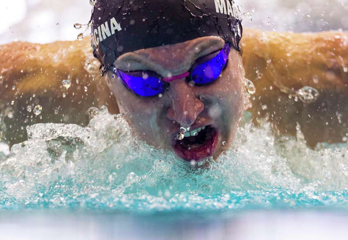 Brayden Mandacina competes Tuesday, Feb. 8, 2022 at the Josh Davis Natatorium in the 100 yard butterfly during the Region VII-6A swimming finals. Mandacina finished first with a time of 49.82.