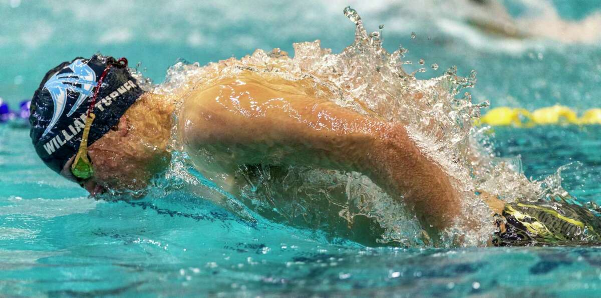 William Turner competes Tuesday, Feb. 8, 2022 at the Josh Davis Natatorium in the butterfly leg of the 200 yard medley relay during the Region VII-6A swimming finals.