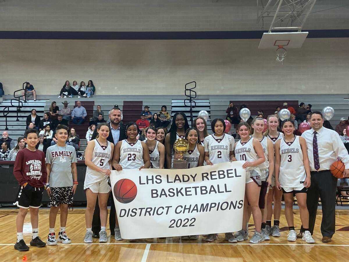 The Legacy girls basketball team celebrates winning a share of the 2021-22 District 2-6A title, Tuesday at Rebel Gymnasium. 