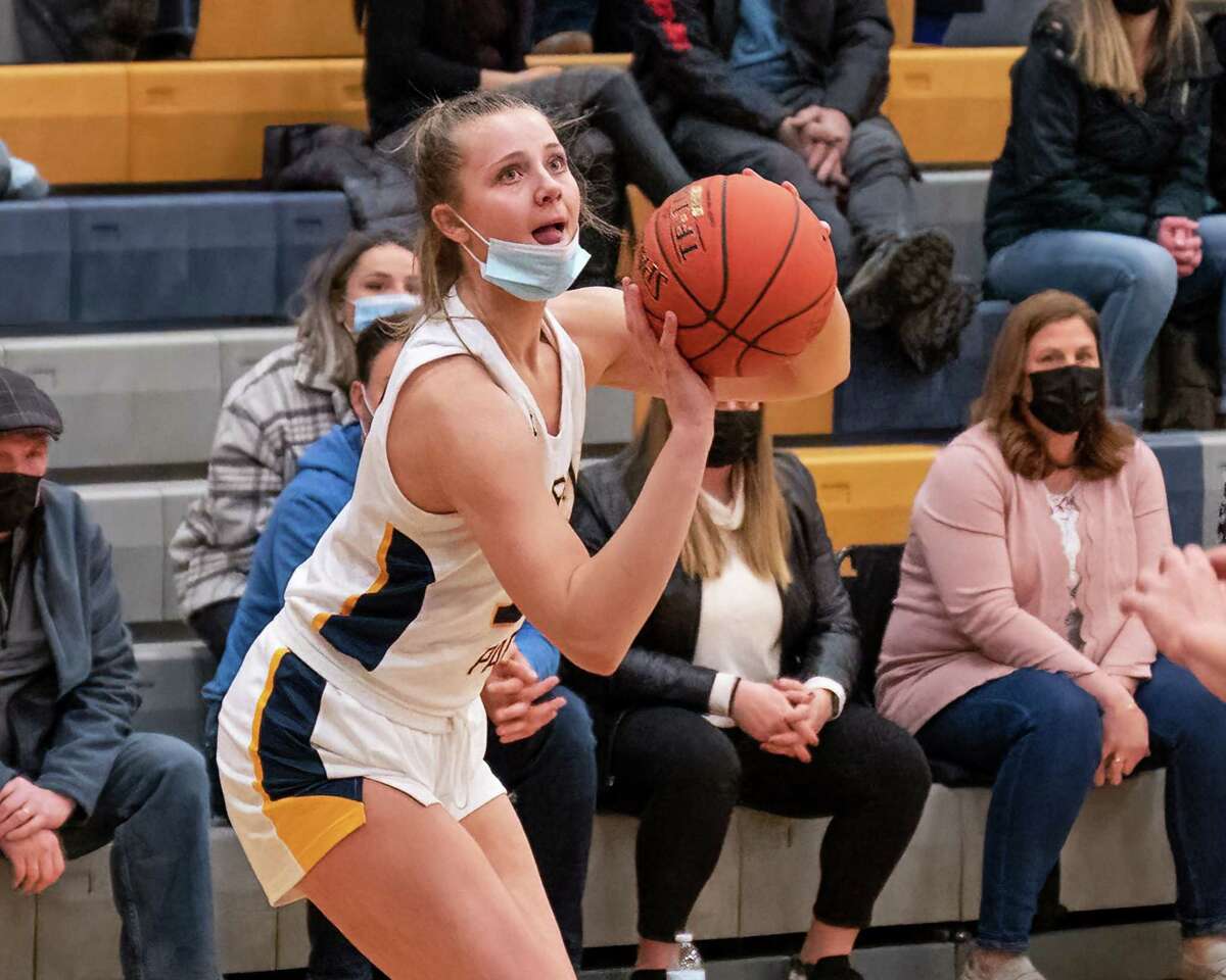 Averill Park senior Amelia Wood lines up a jumper during a Suburban Council matchup against Colonie earlier this season. She had 31 points in the Warriors' sectional opener.