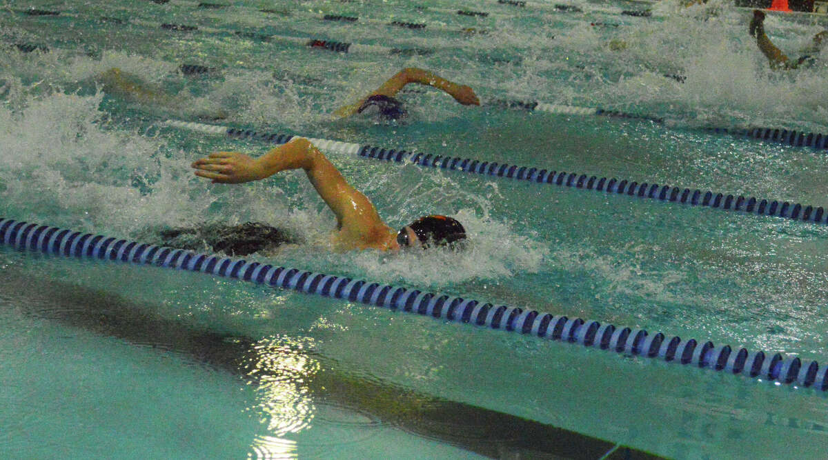 Luke DeConcini swims to a second-place finish in the 100-yard freestyle on Tuesday. 