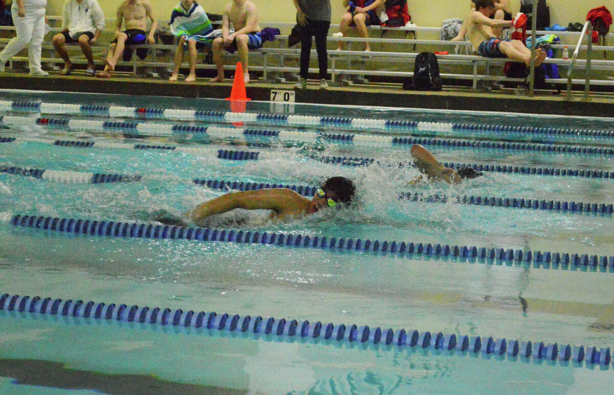 Austin Norcio swims to a first-place finish in the 500-yard freestyle on Friday. 