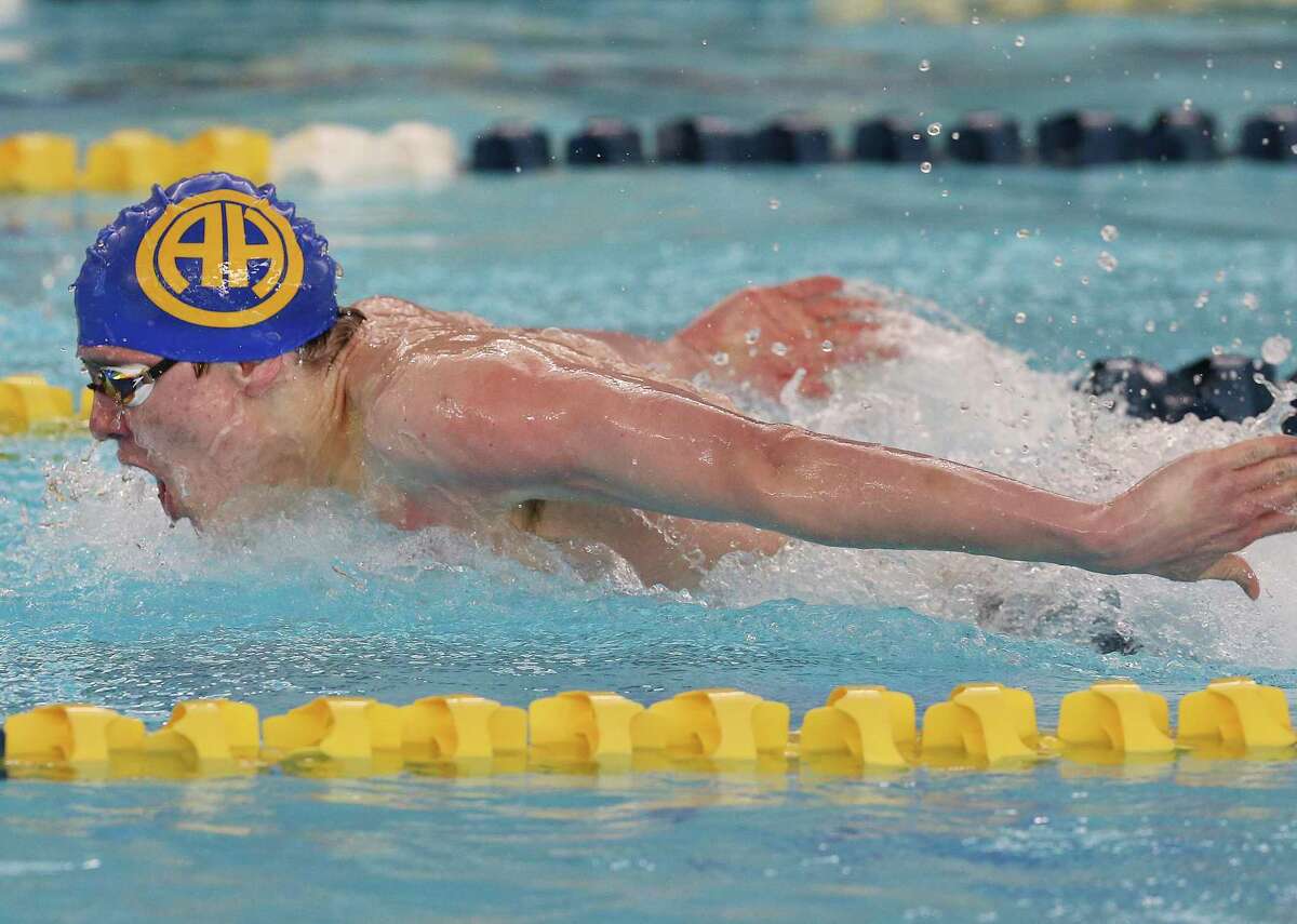 Alamo Heights' Connor Foote takes first place in the boys 100 yard butterfly during the 2022 UIL Region 7-5A Swimming and Diving Championships at Bill Walker Pool on Tuesday, Feb. 8, 2022.
