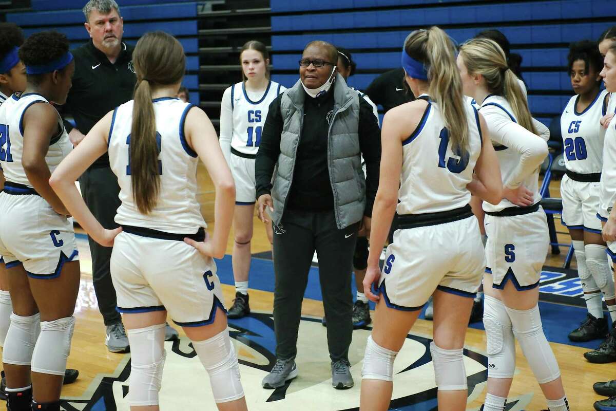 Clear Springs basketball coach Pamela Crawford speaks to her team during a break against Clear Brook Tuesday at Clear Springs High School. Crawford is retiring at the end of the current school year.