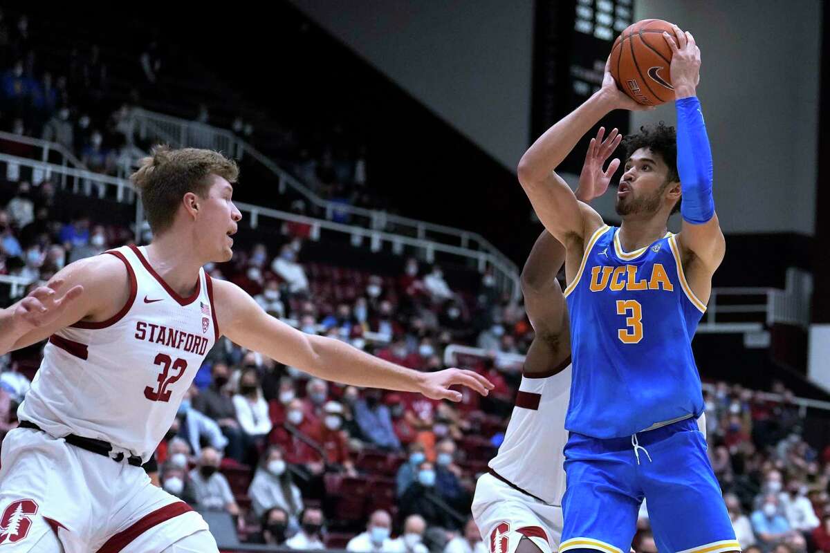 UCLA guard Johnny Juzang (3) shoots over Stanford forward Lukas Kisunas (32) during the second half of an NCAA college basketball game in Stanford, Calif., Tuesday, Feb. 8, 2022. UCLA won 79-70. (AP Photo/Tony Avelar)