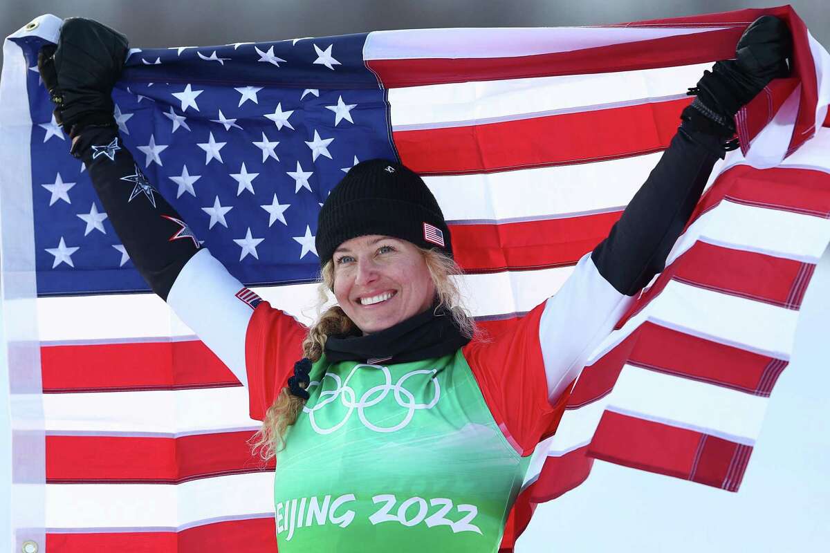 ZHANGJIAKOU, CHINA - FEBRUARY 09: Gold medallist Lindsey Jacobellis of Team United States poses during the Women's Snowboard Cross flower ceremony on Day 5 of the Beijing 2022 Winter Olympic Games at Genting Snow Park on February 09, 2022 in Zhangjiakou, China. (Photo by Clive Rose/Getty Images)