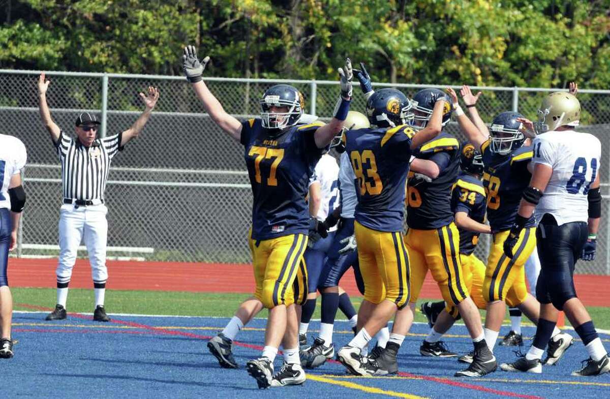Weston's Carmine Magnoli celebrates with his team in the endzone during the first half of the football game against Notre Dame Fairfield at Weston on Saturday, Sept. 25, 2010. Crowell broke up three passes.